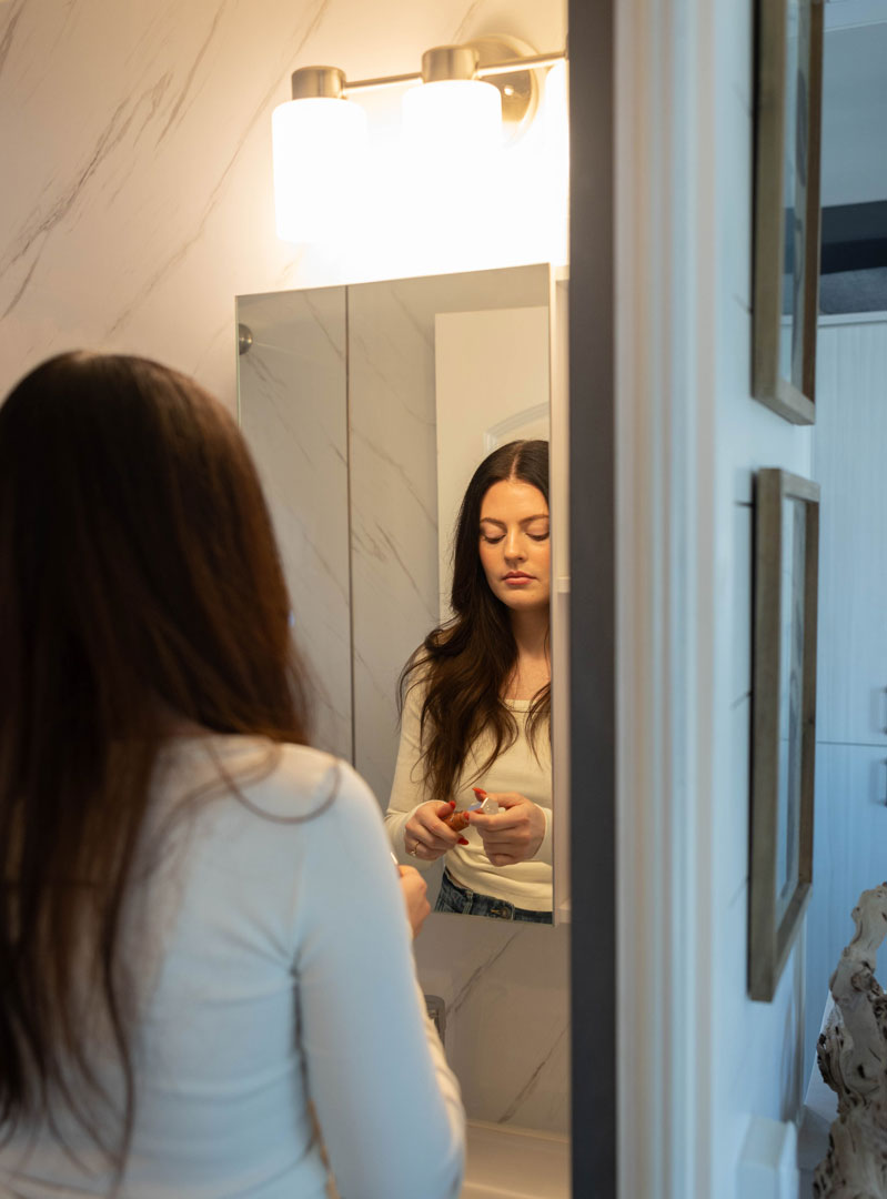 Mirror woman getting ready in bathroom with mirror