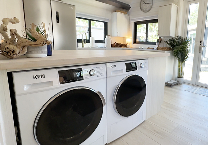 washer-and-fridge Washer and dryer in suite